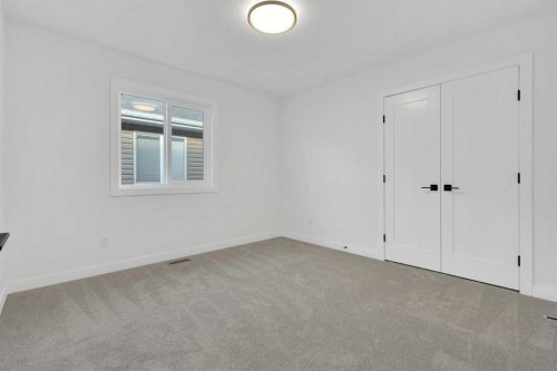 566 Rivercrest View, Cochrane, AB - Indoor Photo Showing Other Room