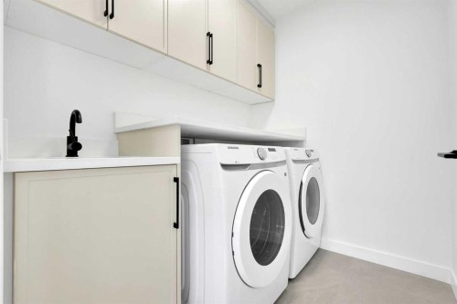 566 Rivercrest View, Cochrane, AB - Indoor Photo Showing Laundry Room