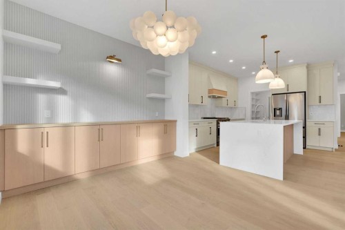 566 Rivercrest View, Cochrane, AB - Indoor Photo Showing Kitchen With Upgraded Kitchen