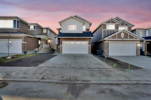 566 Rivercrest View, Cochrane, AB - Outdoor With Facade