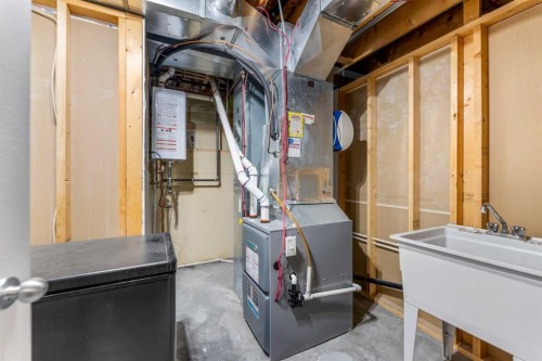 8 Copperfield Manor Se, Calgary, AB - Indoor Photo Showing Basement