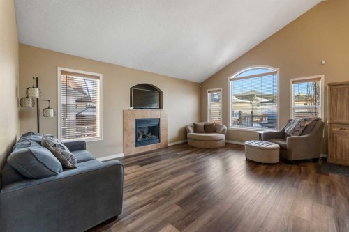 8 Copperfield Manor Se, Calgary, AB - Indoor Photo Showing Living Room With Fireplace