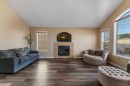 8 Copperfield Manor Se, Calgary, AB  - Indoor Photo Showing Living Room With Fireplace 