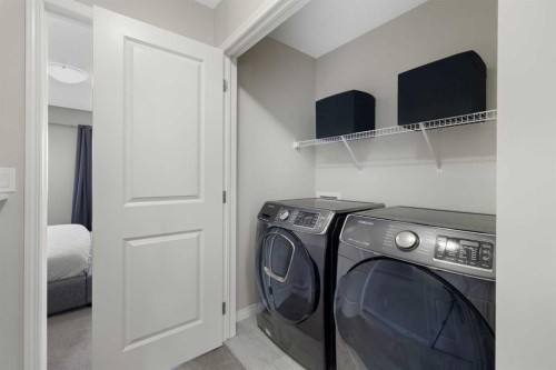 211 Evanscrest Way Nw, Calgary, AB - Indoor Photo Showing Laundry Room