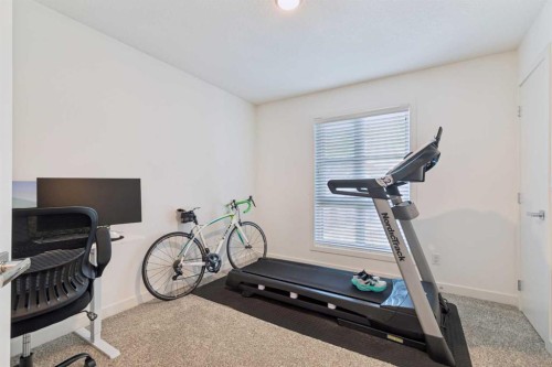 180 Walden Path Se, Calgary, AB - Indoor Photo Showing Gym Room