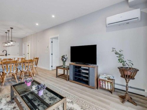 1412-200 Seton Circle Se, Calgary, AB - Indoor Photo Showing Living Room