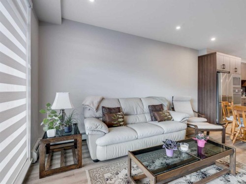 1412-200 Seton Circle Se, Calgary, AB - Indoor Photo Showing Living Room