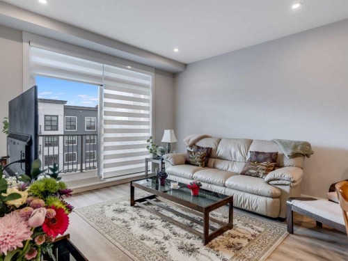 1412-200 Seton Circle Se, Calgary, AB - Indoor Photo Showing Living Room