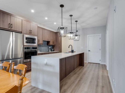1412-200 Seton Circle Se, Calgary, AB - Indoor Photo Showing Kitchen With Upgraded Kitchen