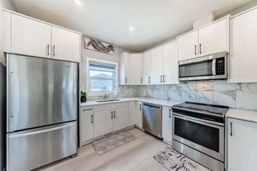 559 Cornerstone Avenue Ne, Calgary, AB - Indoor Photo Showing Kitchen With Double Sink