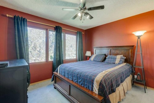 150 Midcrest Crescent Se, Calgary, AB - Indoor Photo Showing Bedroom