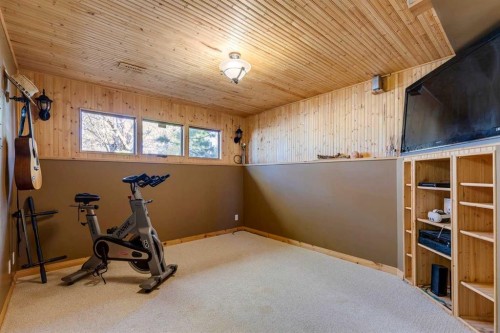 150 Midcrest Crescent Se, Calgary, AB - Indoor Photo Showing Gym Room