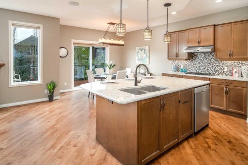 105 Aspen Stone Road Sw, Calgary, AB - Indoor Photo Showing Kitchen With Double Sink With Upgraded Kitchen
