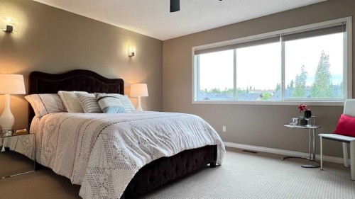 105 Aspen Stone Road Sw, Calgary, AB - Indoor Photo Showing Bedroom