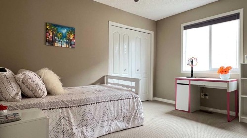 105 Aspen Stone Road Sw, Calgary, AB - Indoor Photo Showing Bedroom