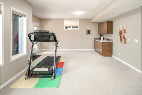 105 Aspen Stone Road Sw, Calgary, AB - Indoor Photo Showing Gym Room