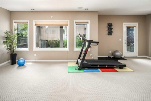 105 Aspen Stone Road Sw, Calgary, AB - Indoor Photo Showing Gym Room