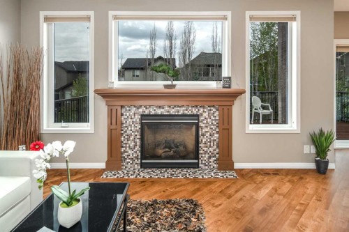 105 Aspen Stone Road Sw, Calgary, AB - Indoor Photo Showing Living Room With Fireplace