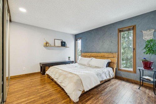 715 Coach Bluff Crescent Sw, Calgary, AB - Indoor Photo Showing Bedroom