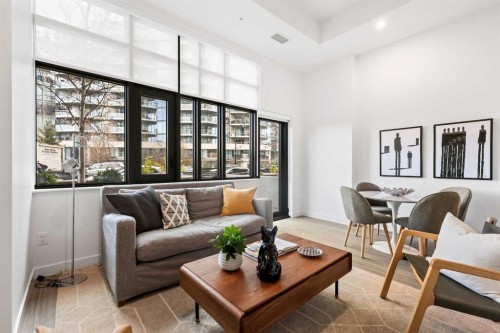 103-730 2 Avenue Sw, Calgary, AB - Indoor Photo Showing Living Room