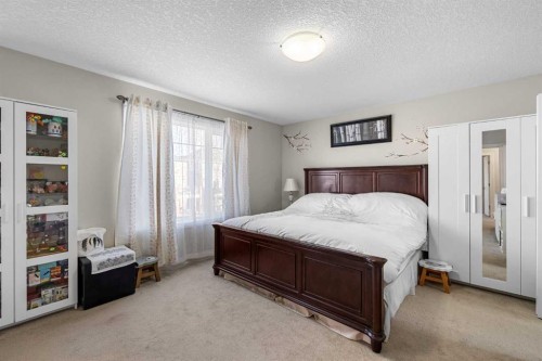 107 Panatella Close Nw, Calgary, AB - Indoor Photo Showing Bedroom