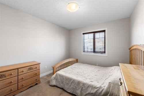 107 Panatella Close Nw, Calgary, AB - Indoor Photo Showing Bedroom