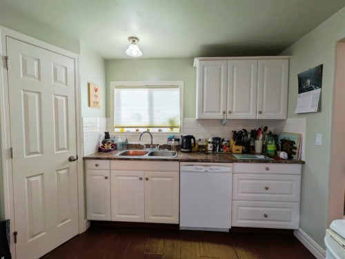 119 47 Avenue West, Claresholm, AB - Indoor Photo Showing Kitchen With Double Sink