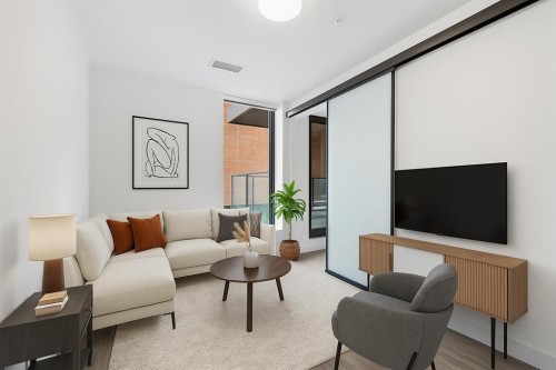 207-730 2 Avenue Sw, Calgary, AB - Indoor Photo Showing Living Room