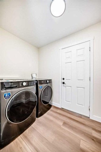 936 Cranston Drive Se, Calgary, AB - Indoor Photo Showing Laundry Room