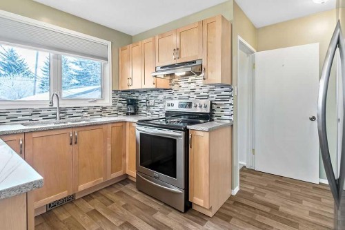 312 Foritana Road Se, Calgary, AB - Indoor Photo Showing Kitchen With Double Sink