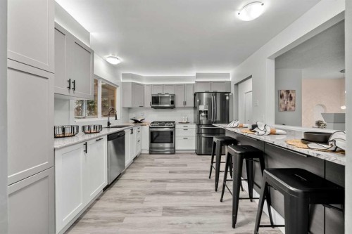 3251 Bearspaw Drive Nw, Calgary, AB - Indoor Photo Showing Kitchen With Stainless Steel Kitchen With Upgraded Kitchen