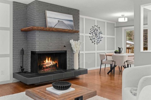 3251 Bearspaw Drive Nw, Calgary, AB - Indoor Photo Showing Living Room With Fireplace