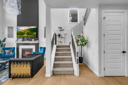 459 Savanna Way Ne, Calgary, AB - Indoor Photo Showing Other Room With Fireplace