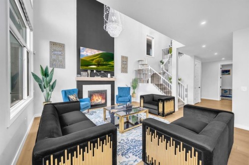 459 Savanna Way Ne, Calgary, AB - Indoor Photo Showing Living Room With Fireplace