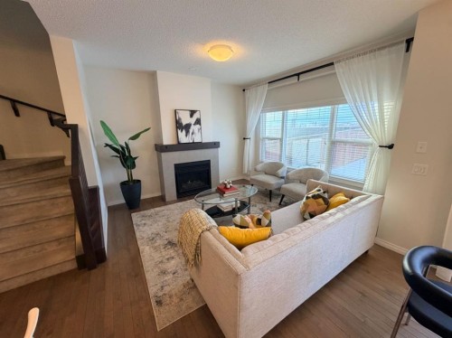 188 Walden Parade Se, Calgary, AB - Indoor Photo Showing Other Room With Fireplace