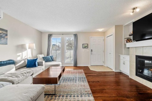 32 Auburn Bay Boulevard Se, Calgary, AB - Indoor Photo Showing Living Room With Fireplace