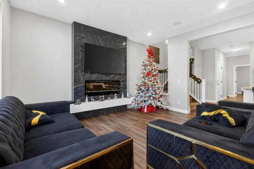 66 Belmont Manor Sw, Calgary, AB - Indoor Photo Showing Living Room With Fireplace