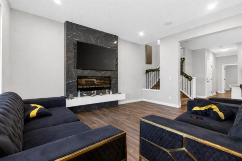 66 Belmont Manor Sw, Calgary, AB - Indoor Photo Showing Living Room With Fireplace