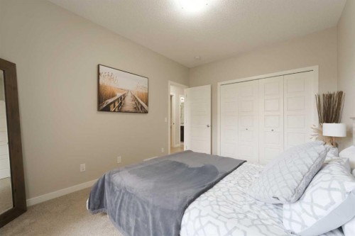701-250 Fireside View, Cochrane, AB - Indoor Photo Showing Bedroom