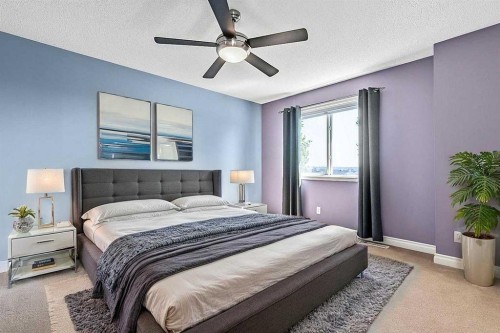 521 Westmount Close, Okotoks, AB - Indoor Photo Showing Bedroom