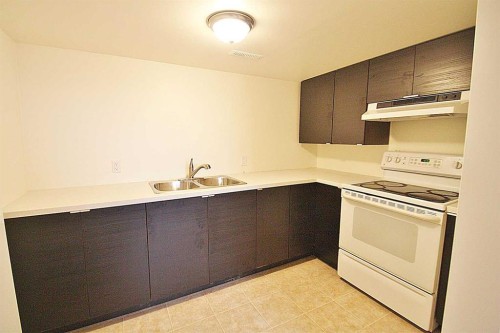 203 Falwood Way Ne, Calgary, AB - Indoor Photo Showing Kitchen With Double Sink