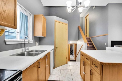 6934 Laguna Way Ne, Calgary, AB - Indoor Photo Showing Kitchen With Double Sink