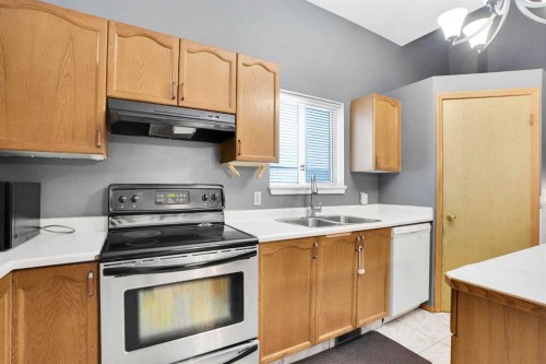 6934 Laguna Way Ne, Calgary, AB - Indoor Photo Showing Kitchen With Double Sink