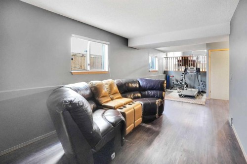 6934 Laguna Way Ne, Calgary, AB - Indoor Photo Showing Living Room