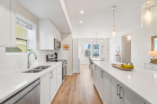 160 Copperleaf Way Se, Calgary, AB - Indoor Photo Showing Kitchen With Double Sink With Upgraded Kitchen