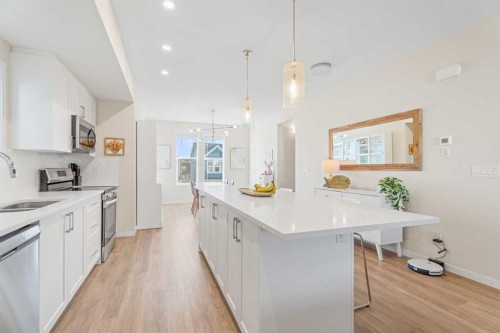 160 Copperleaf Way Se, Calgary, AB - Indoor Photo Showing Kitchen With Double Sink With Upgraded Kitchen