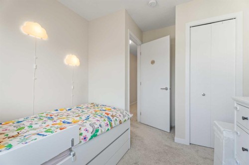 160 Copperleaf Way Se, Calgary, AB - Indoor Photo Showing Bedroom