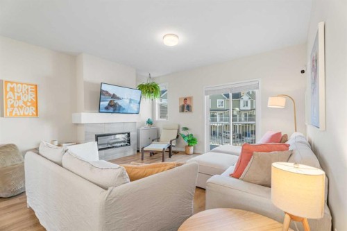 160 Copperleaf Way Se, Calgary, AB - Indoor Photo Showing Living Room With Fireplace