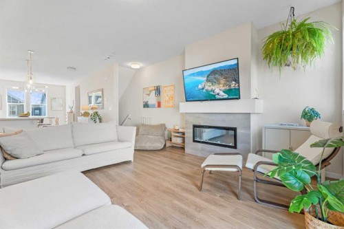 160 Copperleaf Way Se, Calgary, AB - Indoor Photo Showing Living Room With Fireplace