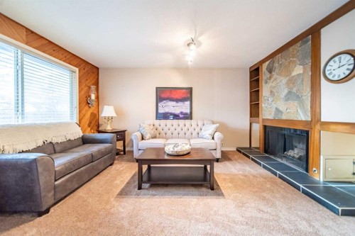 959 Ranchview Crescent Nw, Calgary, AB - Indoor Photo Showing Living Room With Fireplace
